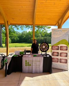 Cornerstone Dental Associates' table at Healthy Kids Day at the Dover Foundation YMCA